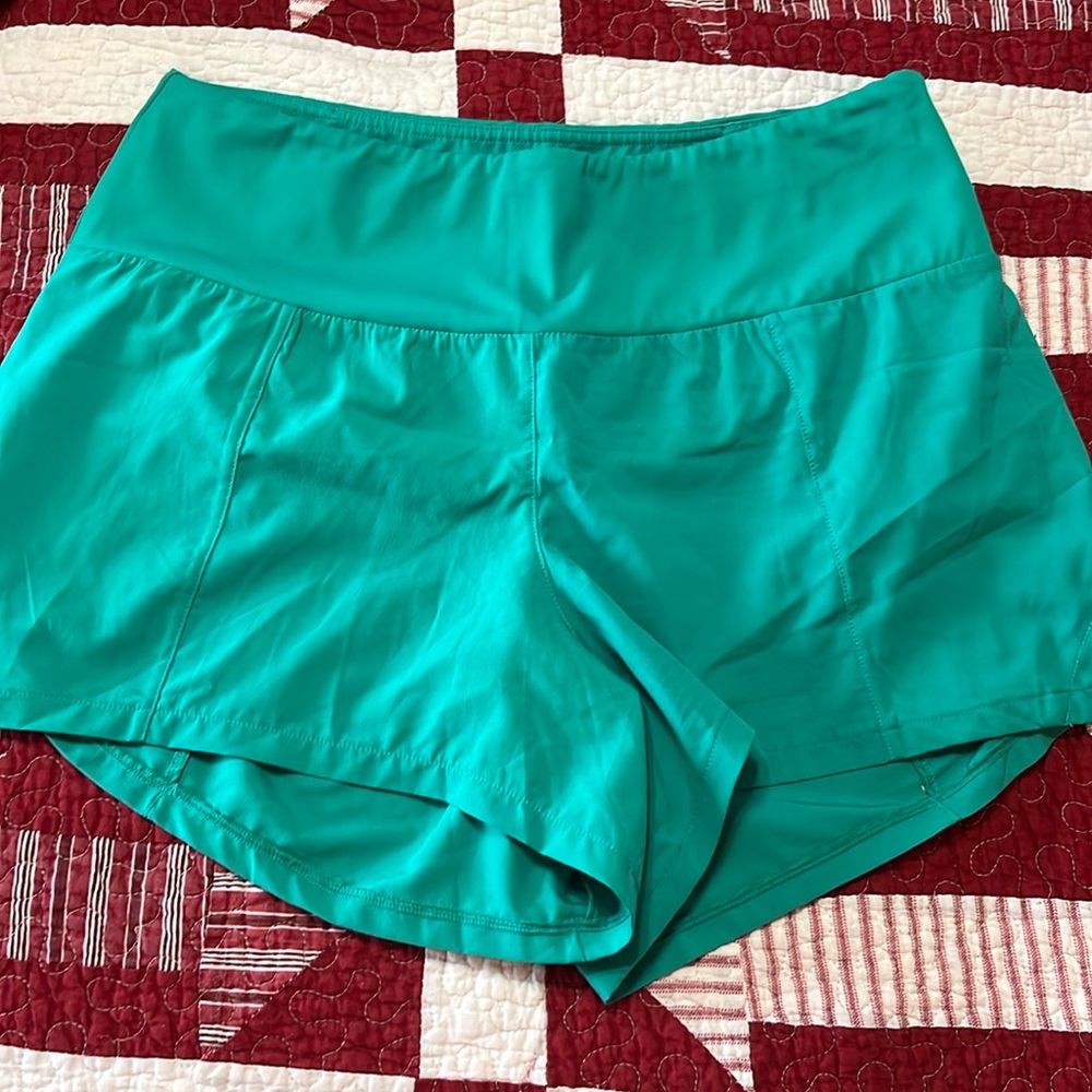 Women’s CVG green running shorts